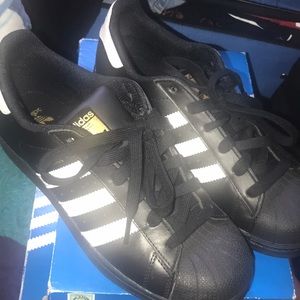 Black white and gold Adidas Shelltoes